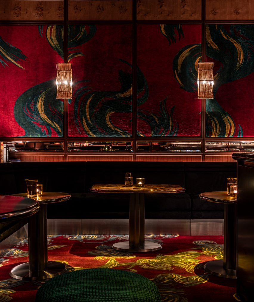 The walls of the seating area are covered with textiles