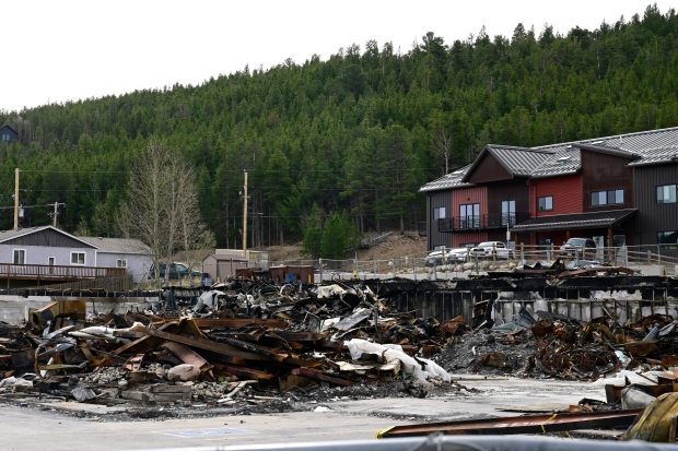 Debris from the 2025 fire can be seen at the Caribou Village Shopping Center in Holland on Tuesday. (Joel Solis/Staff Photographer)