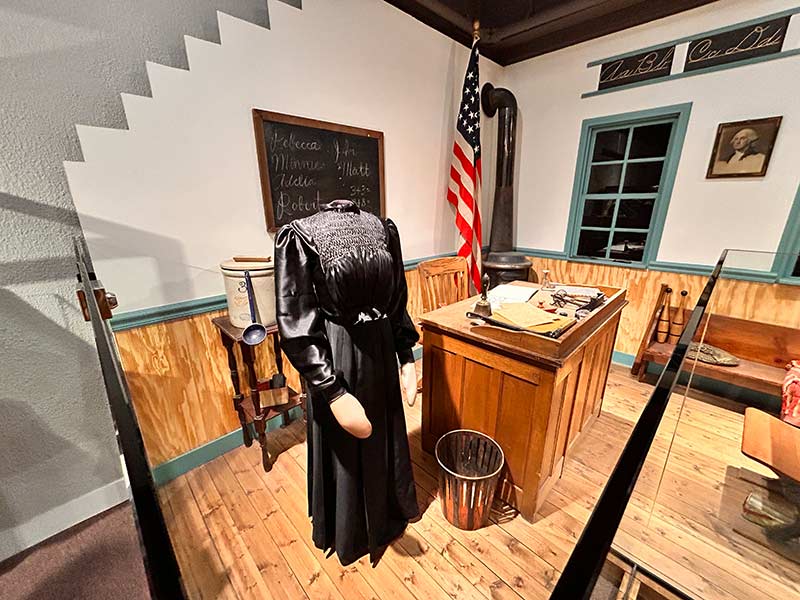 Rebecca Brown Mitchell's dress is on display in a recreation of a classroom at the Museum of Idaho. Rhett Nelson, EastIdahoNews.com