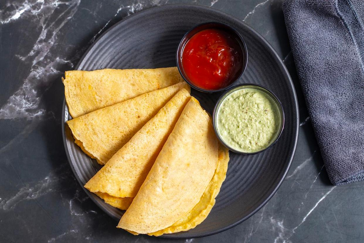 Moong dal chilla is an Indian pancake made from ground mung beans that is typically enjoyed across northern India as a quick, protein- and fiber-rich breakfast or snack. Credit: I am a photographer and artist / Getty Images
